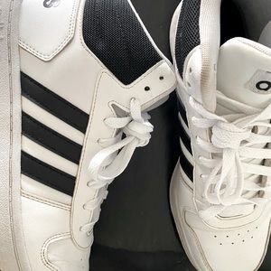 Men’s Adidas basketball shoes size 8.5 color white leather with black stripes.